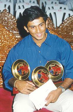 Amit Pagnis with his 3 junior-cricketer-of-the-year prizes.