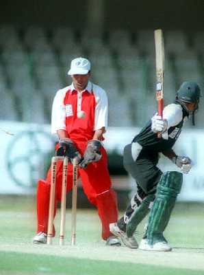 Saeed Anwar Junior of KRL is bowled by Wapda's Sarfraz Ahmed