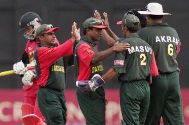 Rahman, Islam, Masud and Khan celebrate the wicket of Carlisle