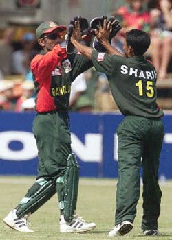 Khaled Mashud greets Mohammed Sharif for the wicket of Guy Whittall