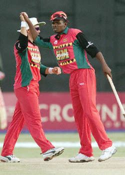 Heath Streak and David Mutendera link hands after Zimbabwe's 127 run win