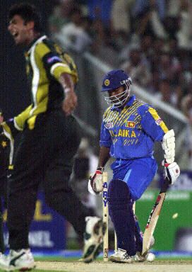 New fast bowler Kashif Raza celebrates his first ODI wicket after bowling Kaluwitharana