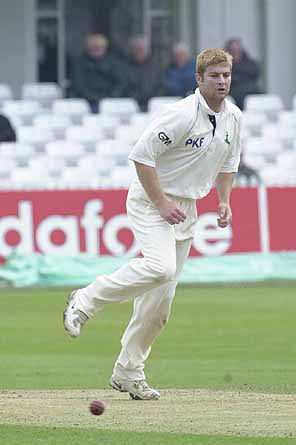 Richard Logan bowls from the Trent Bridge pavilion end