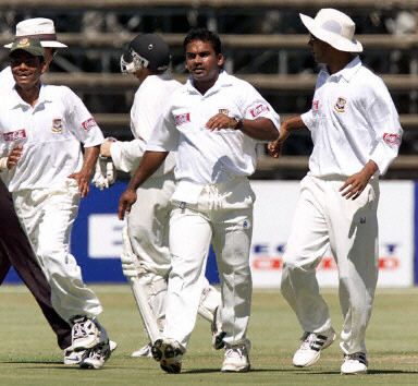 Naimur Rahman runs to congratulate his team mates on the run out of Whittall
