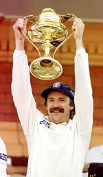Jack Russell holding trophy