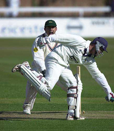 Leics keeper Burns shouts for a run out but Durham's Lewis is home