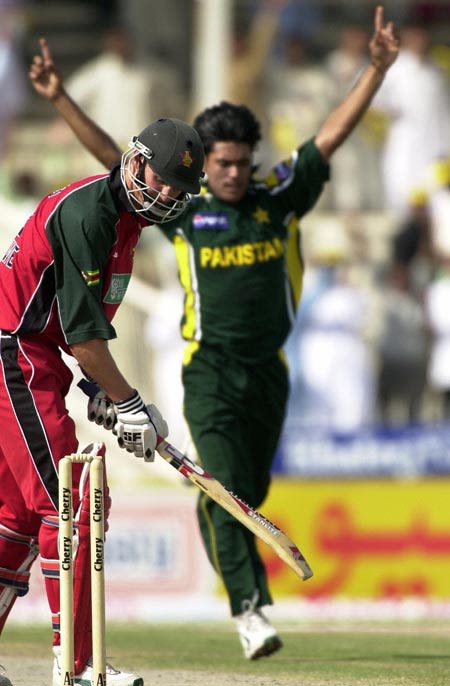Douglas Marillier (L) looks back at his shattered stumps