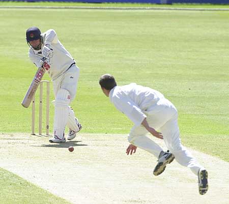 Graham Lloyd drives bowler Clough