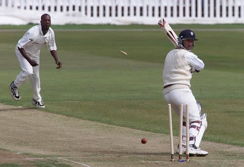 Durham's Martin Speight is bowled by Warwickshire's Vasbert Drakes