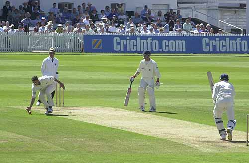 Ostler belts the ball back past Greg Smith
