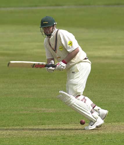 Leics skipper Vince Wells squeezes a ball down on a greenish wicket at Derby