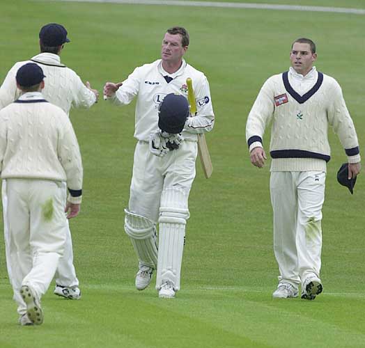 David Byas gets congratulated by his former Yorkshire team mates