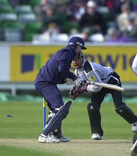 Andrew Pratt is stumped by Keith Piper in the battle of the keepers