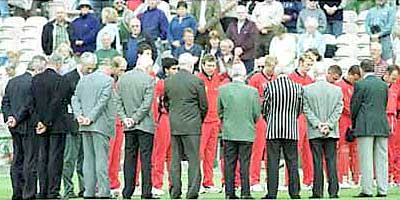 Lancashire players and committee stand as a mark of respect for Brian Statham who died today.