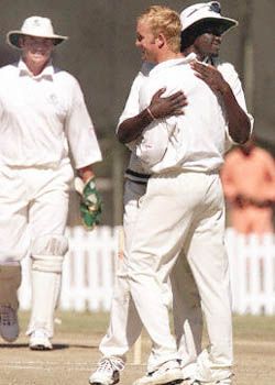 Sean Ervine and Mluleki Nkala celebrate Sameer Dighe's fall