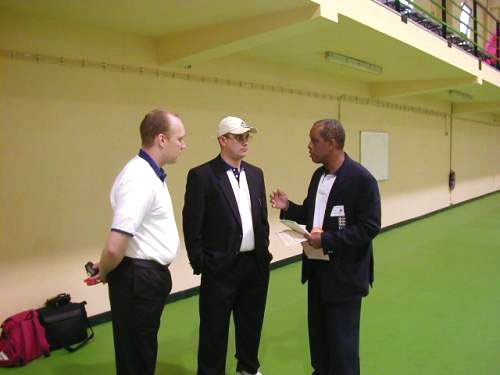 John Holder (right) briefing other umpires at the Indoor Tournament