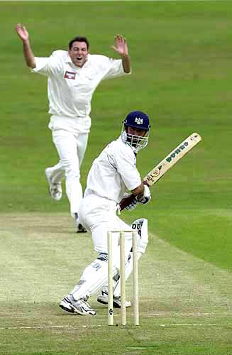 Kim Barnett of Gloucs has just inside edged a ball from Chris Silverwood but he is safe