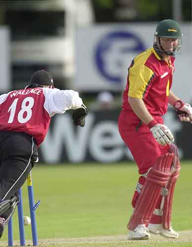 Vince Wells is bowled by Robert Croft for 16