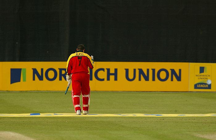 Neil Burns walks off after being dismissed