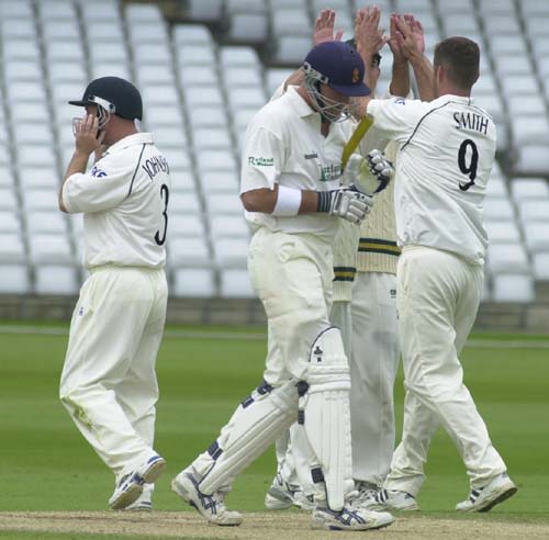 Joy for bowler Greg Smith as he has the departing Steve Stubbings out for 7