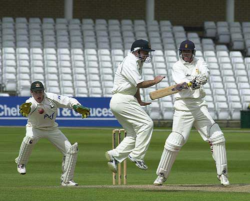 Chris Bassano sends sillymid-off Johnson into the air and keeper Read ball chasing