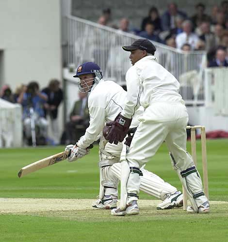 Andy Flower with a reverse sweep as keeper Piper can only look on
