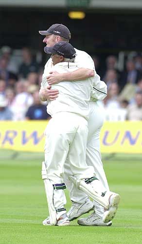 Dougie Brown gets a hug from Keith Piper