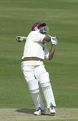 Runako Morton hoists a delivery from Lungley to be caught by Gunter for 0
