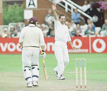 Scuderi watches in delight as Lathwell walks back to the pavilion after being trapped LBW