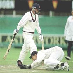 Neil Fairbrother leaves the crease after being caught out by Rob Turner