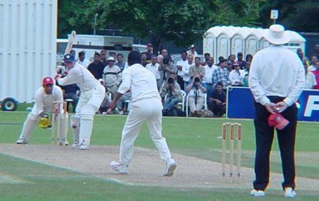 Wright shapes to swing a delivery from Harris over midwicket