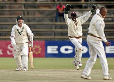 Courtney Brown and Neil McGarrell appeal for lbw against Guy Whittall
