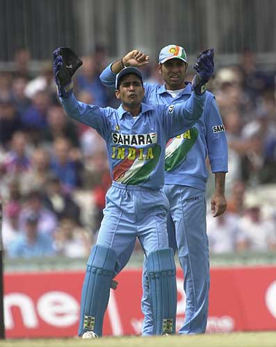 Keeper Ratra implores the umpire for a decision but Laxman looks a little puzzled