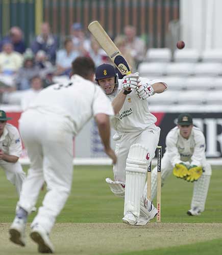 Derbyshire's Andrew Gait manages to squeeze a Smith delivery back through mid-on