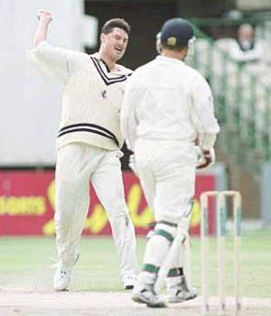 Martin McCague celebrates trapping Hegg LBW