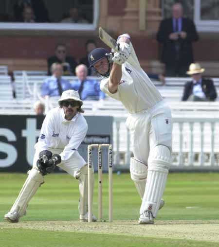 A firm drive from Dominic Ostler to add 2 runs to Warwickshire's total