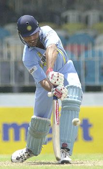 Reetinder Sodhi looks to hoick the ball over the on side
