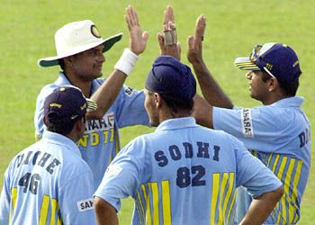 The Indians get together in celebration, as yet another Lankan wicket has fallen