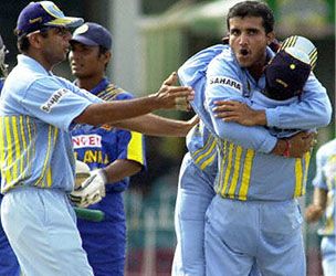An emotional Ganguly is embraced by stumper Dighe as the Indians inch towards victory