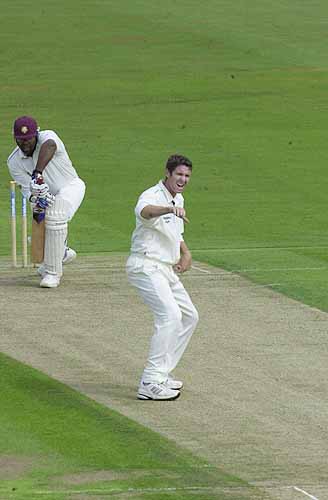 Bowler Ben Trott seems to give his own lbw appeal against Rollins the thumbs down.
