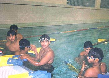 Deepak Chougule, Vinayak Mane and Parthiv Patel in the swimming pool in Adelaide