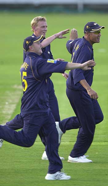 From the left, Ashley Thorpe, bowler Mark Davies and Danny Law celebrate the dismissal of Ian Thomas