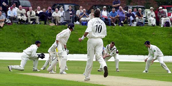 David Byas edges a Caddick delivery just in front of Keith Dutch at second slip