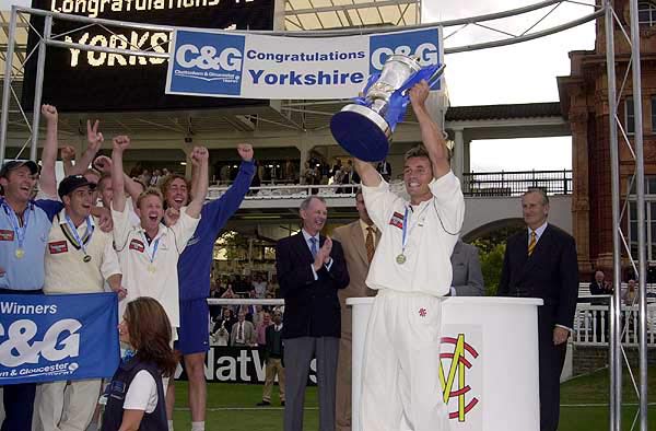 Richard Blakey holds the Trophy aloft for winners Yorkshire