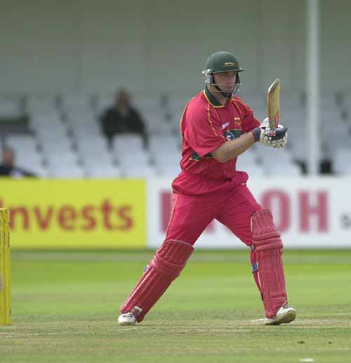 Dakin stands firm at his wicket after a delivery from Outlaw bowler Smith
