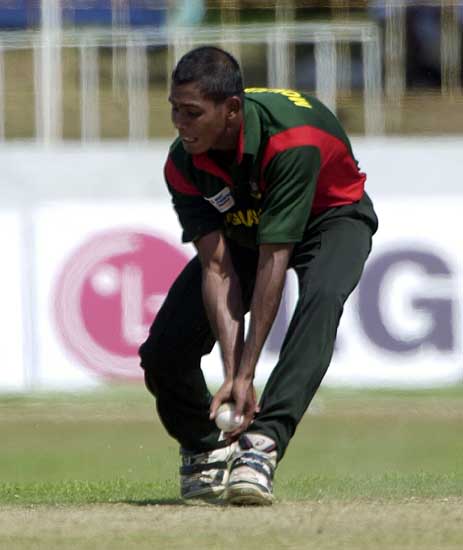 Manjurul gets down to field off his own bowling