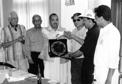 Mr. Jahangir Mughal, Convenor, Karachi Gymkhana Sports Committee presents a momento to the Kuwait Team Manager, Mirza Asad Baig