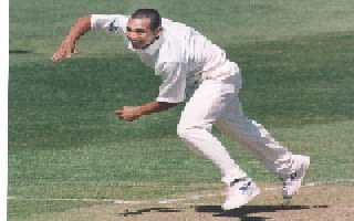 Gary Butcher bowling for Glamorgan during a Championship match in April 1997