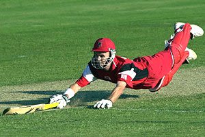 Vaughan dives for the crease, Queensland v South Australia, Mercantile Mutual Cup, 2000/01