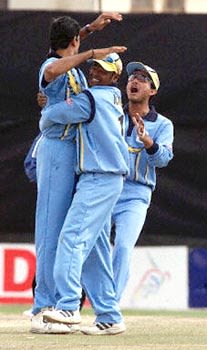 Kambli hugs Prasad while Ganguly is elated about the fall of a new Zealand wicket